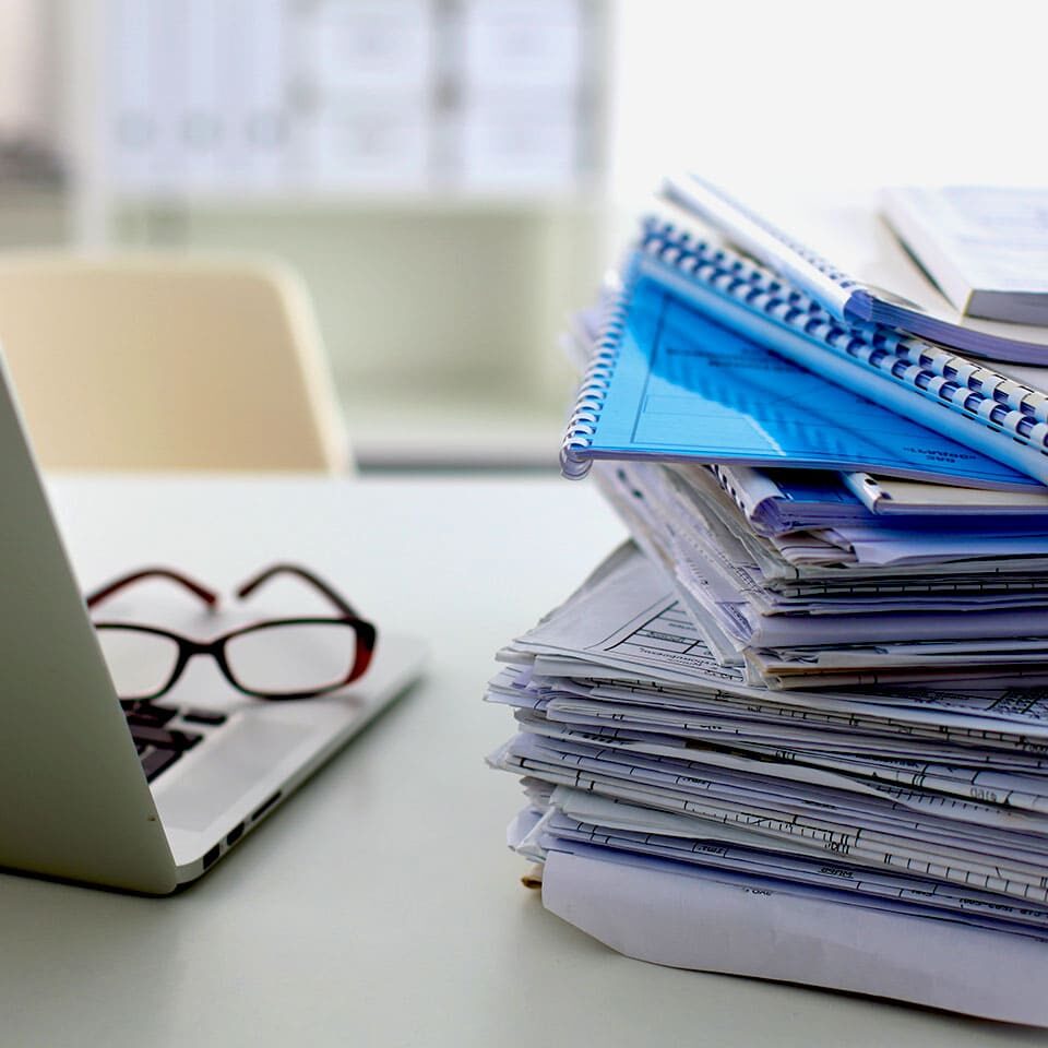 Stack of papers and glasses lying on table desaturated Stack of papers and glasses lying on table desaturated.